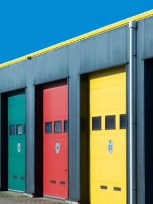 Overhead dock doors at a busy warehouse and logistics hub