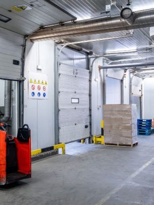 Insulated industrial doors in a cold storage facility